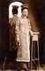 Malaysia / Singapore: A Peranakan bride  poses beside a mirror, Penang, c. 1925